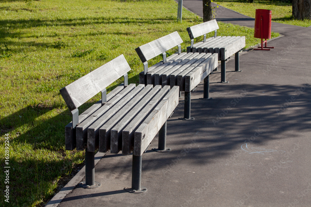 Park benches with trashcan, part of city infrastructure, comfortable relax Park benches with trashcan, part of city infrastructure, comfortable relax