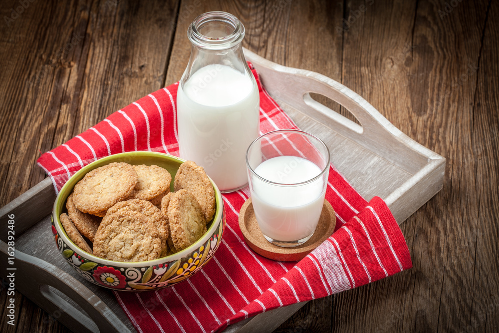 Stack of freshly baked oat biscuits in a bowl. Stack of freshly baked oat biscuits in a bowl.