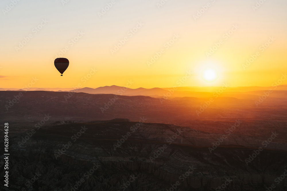 Fototapeta premium The famous tourist attraction of Cappadocia is an air flight. Cappadocia is known all over the world as one of the best places for flights with balloons. Cappadocia, Turkey.