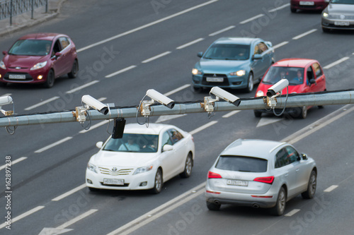 Closeup of four traffic security camera surveillance CCTV on the road in the big city © Aleksei