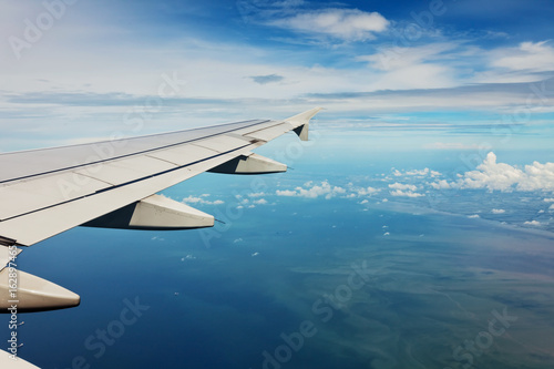 Blue sky and sun view over the wing