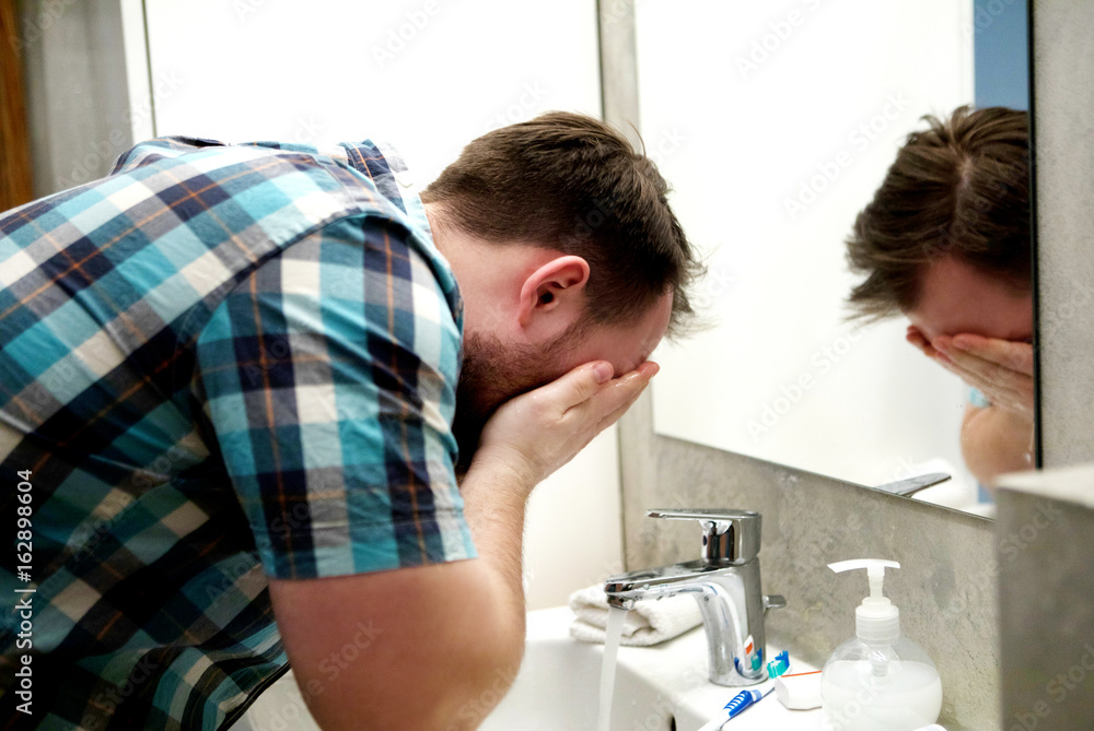 Fototapeta premium Washing and refreshing face.