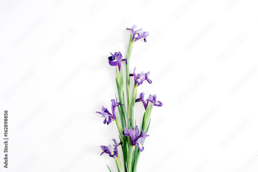 Fototapeta premium Beautiful purple iris flowers bouquet on white background. Flat lay, top view