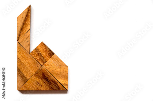 Wooden tangram puzzle in factory or home shape on white background