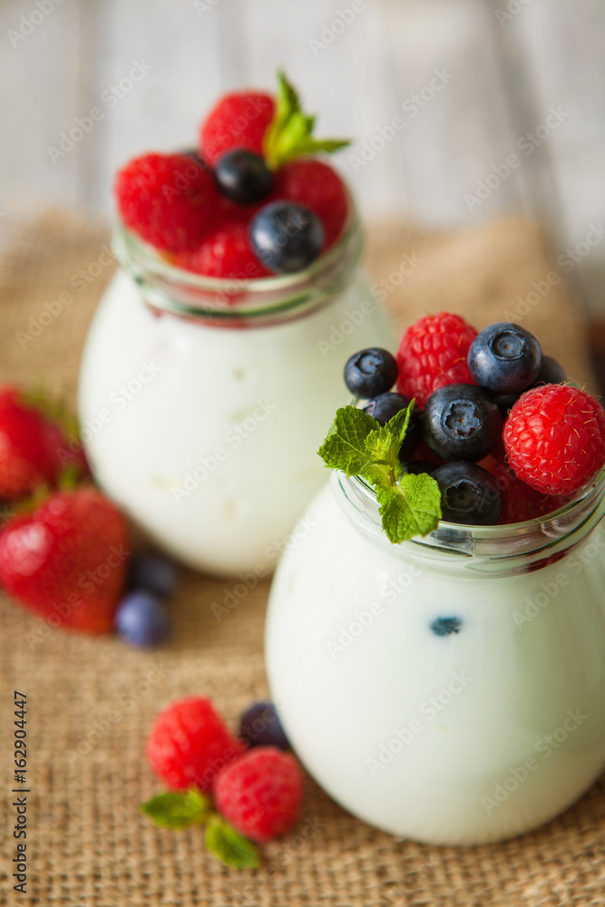 Natural yogurt with fresh berries and nuts Natural yogurt with fresh berries and nuts