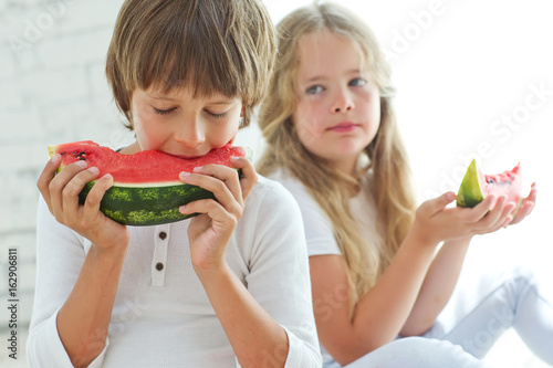 Children eat watermelon 