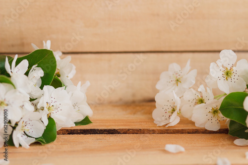 Pear's blossom on the wooden table
