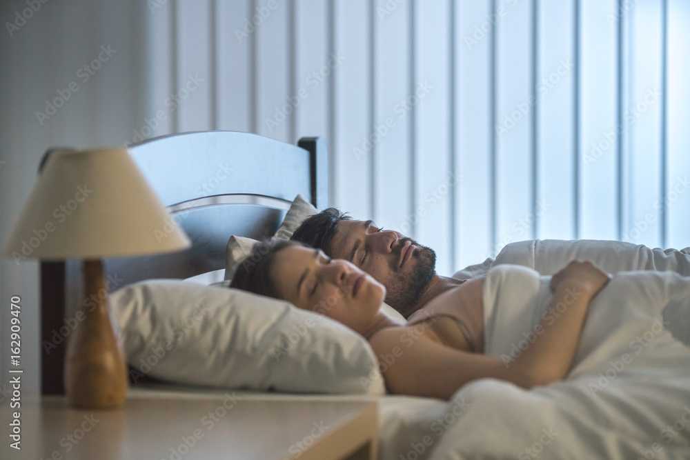 The sleeping lovers on the bed The sleeping lovers on the bed