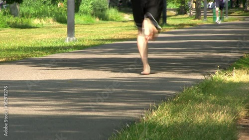 A walking path along Charles river in Boston provides perfect place to enjoy nature and outdoors on summer day.   photo