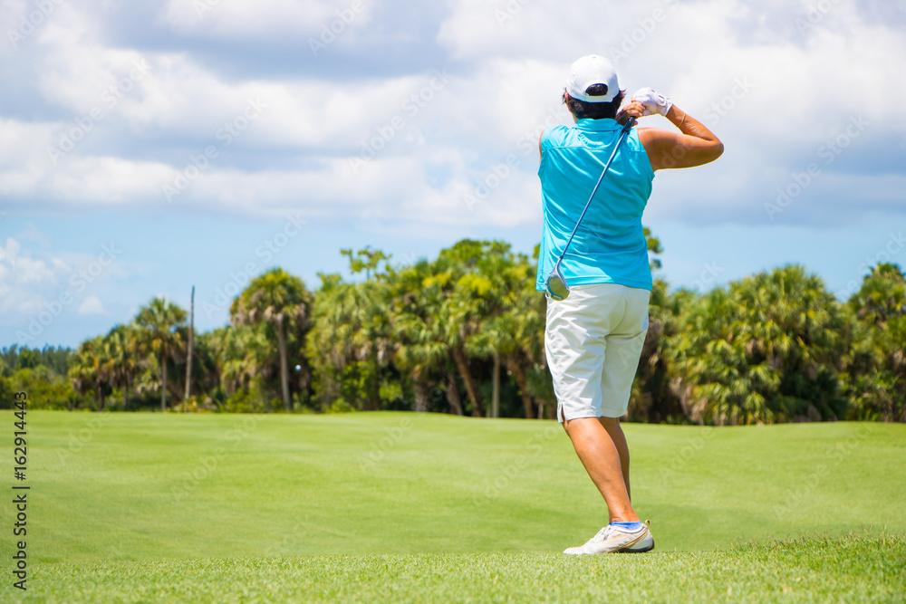Golfer Hitting Ball on Beautiful Golf Course
Golfer Hitting Ball on Beautiful Golf Course