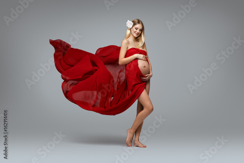 Pregnant girl in red dress
