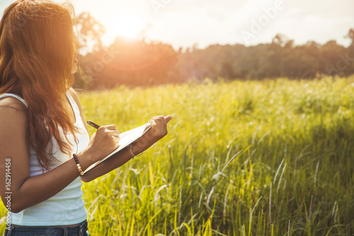 Women write notes Nature trails, mountains, forests. Writer. Asian women