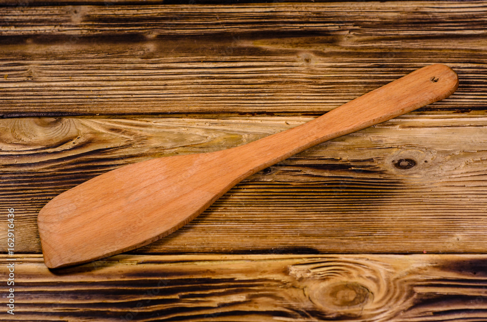 Kitchen spatula on wooden table Kitchen spatula on wooden table