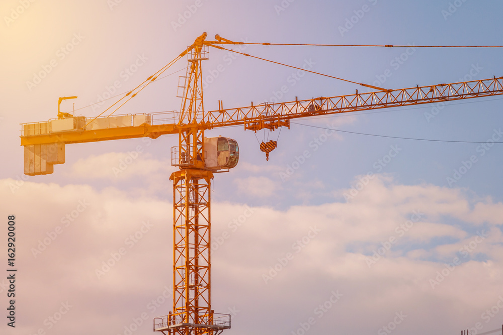 Tower crane illuminated by sun (toned)