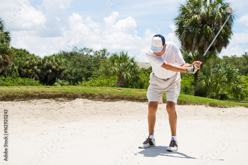 Golfer Hitting Ball from Sand 