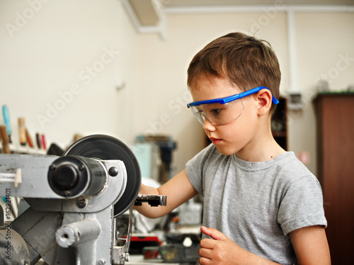 A boy makes a car model