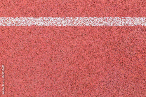 rubber running track texture with white line © deaw59