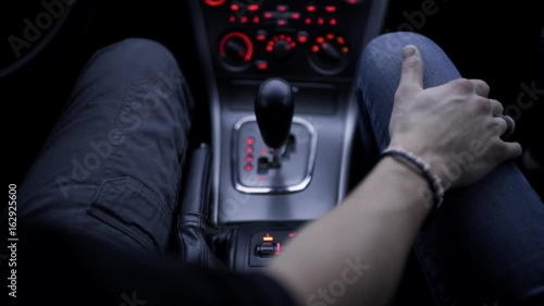 Tender Moment Between A Couple On A Drive, They Hold Hands 