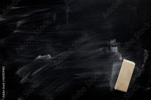 eraser on blackboard for background. photo