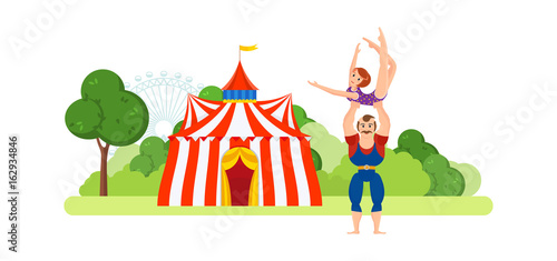 Circus chapiteau building. Athlete, holds on hands girl in sportswear.