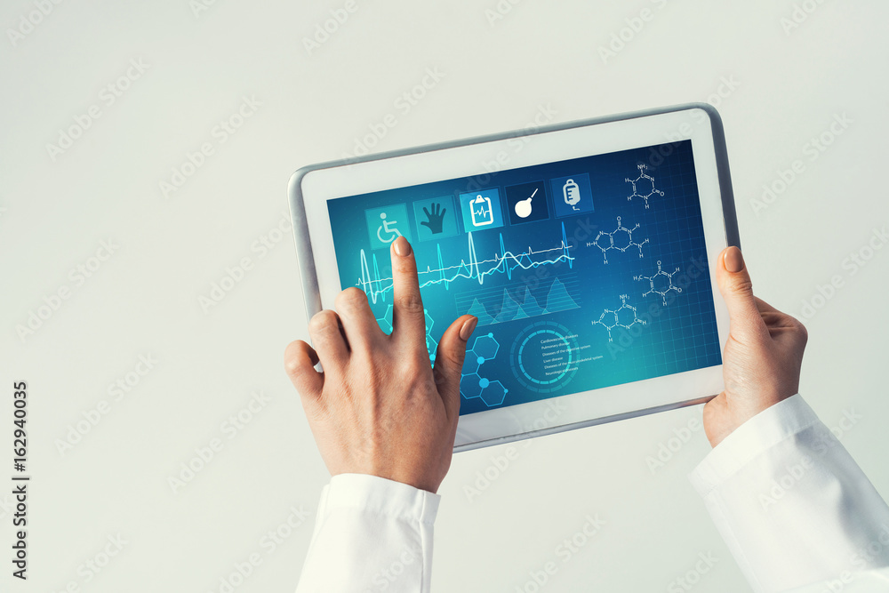 Close of female doctor hands working with tablet pc computer Close of female doctor hands working with tablet pc computer