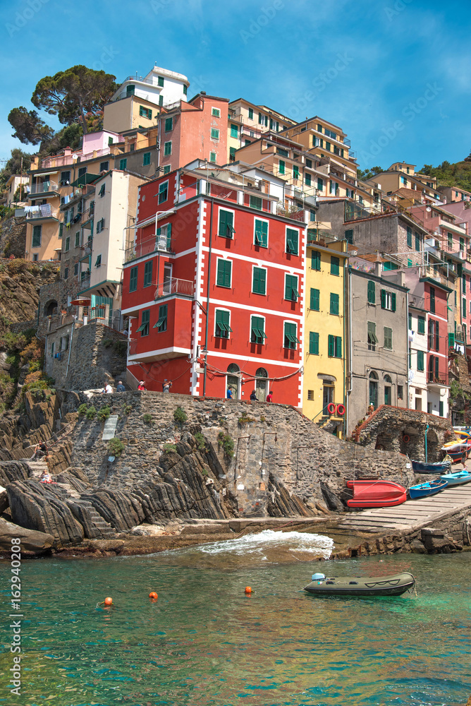 Beautiful, colorful summer landscape with stones on the coast of Riomaggiore in Cinque Terre, Liguria, Italy, Europe