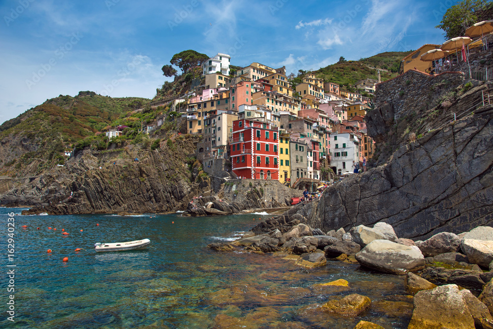 Beautiful, colorful summer landscape with stones on the coast of Riomaggiore in Cinque Terre, Liguria, Italy, Europe