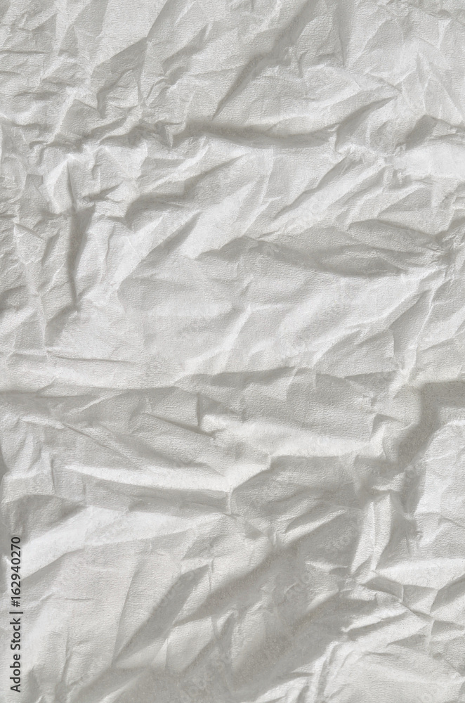 White Background texture / close up of a creased, white, soft paper texture, full frame, vertical White Background texture / close up of a creased, white, soft paper texture, full frame, vertical