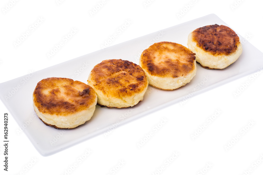Fried curd cheese cakes on white background.