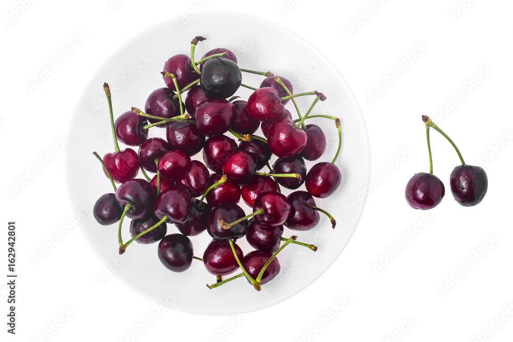 Seasonal fruit: aromatic sweet ripe cherry in plate isolated on Seasonal fruit: aromatic sweet ripe cherry in plate isolated on