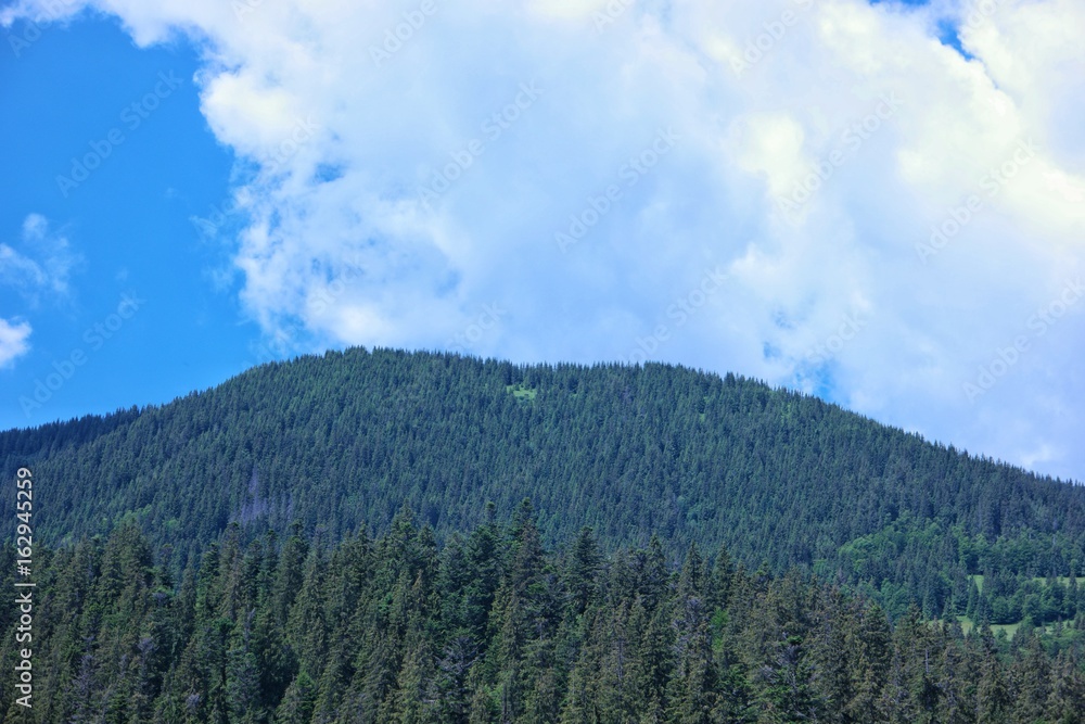 Panorama of Carpathians Mountains against the background of the sky and clouds