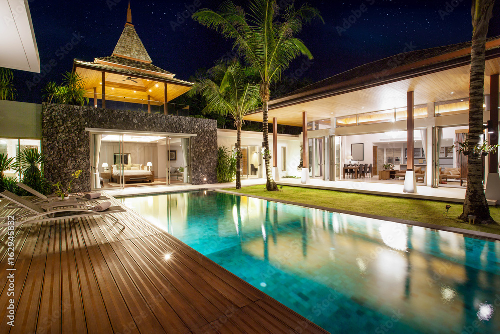 Interior and exterior design of pool villa which features living area ...