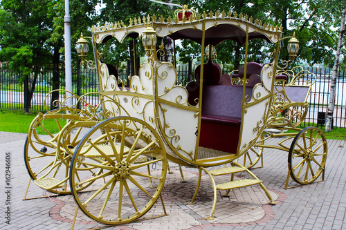 Golden carriage in the park, retro photo