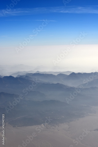 View of the mountains from airplane window © Volodymyr