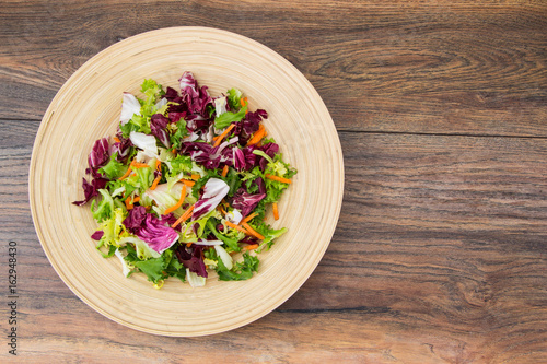 Mix salads with pomegranate and ham