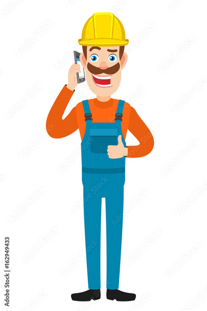 Builder talking on mobile phone and showing thumb up