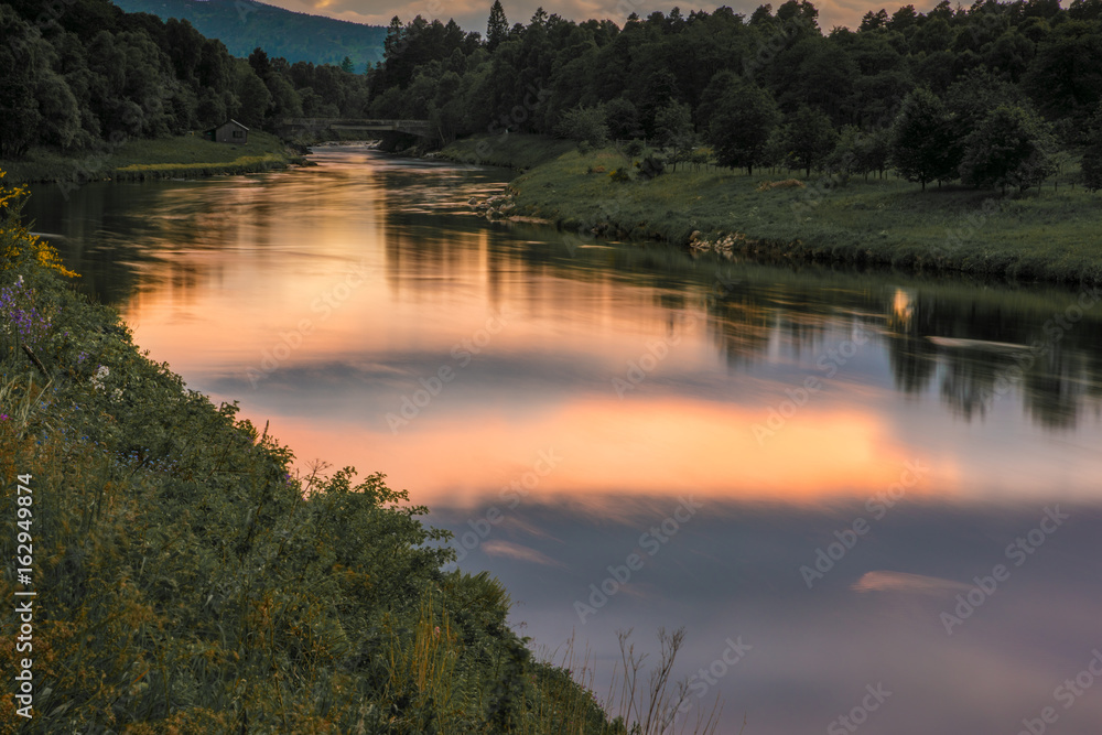 Peach Sunset on Slow River at Long Exposure Peach Sunset on Slow River at Long Exposure