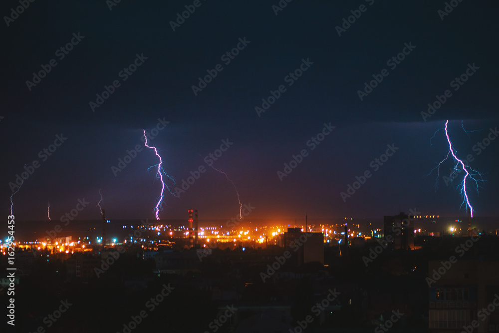 Photo of beautiful powerful lightning over big city, zipper and thunderstorm, abstract background, dark blue sky with bright electrical flash, thunder and thunderbolt, bad weather concept Photo of beautiful powerful lightning over big city, zipper and thunderstorm, abstract background, dark blue sky with bright electrical flash, thunder and thunderbolt, bad weather concept