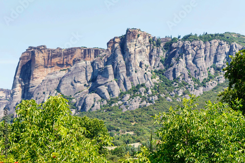 Green trees and rock mountains at sunset in Greece, Corfu photo