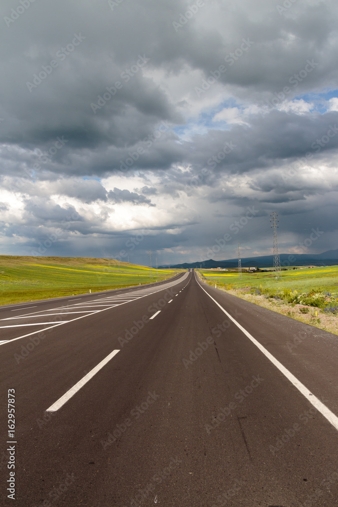 Highway. Open views and sunny weather to travel.