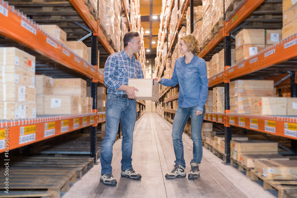 standing workers in warehouse checking invoice Stock Photo | Adobe Stock
