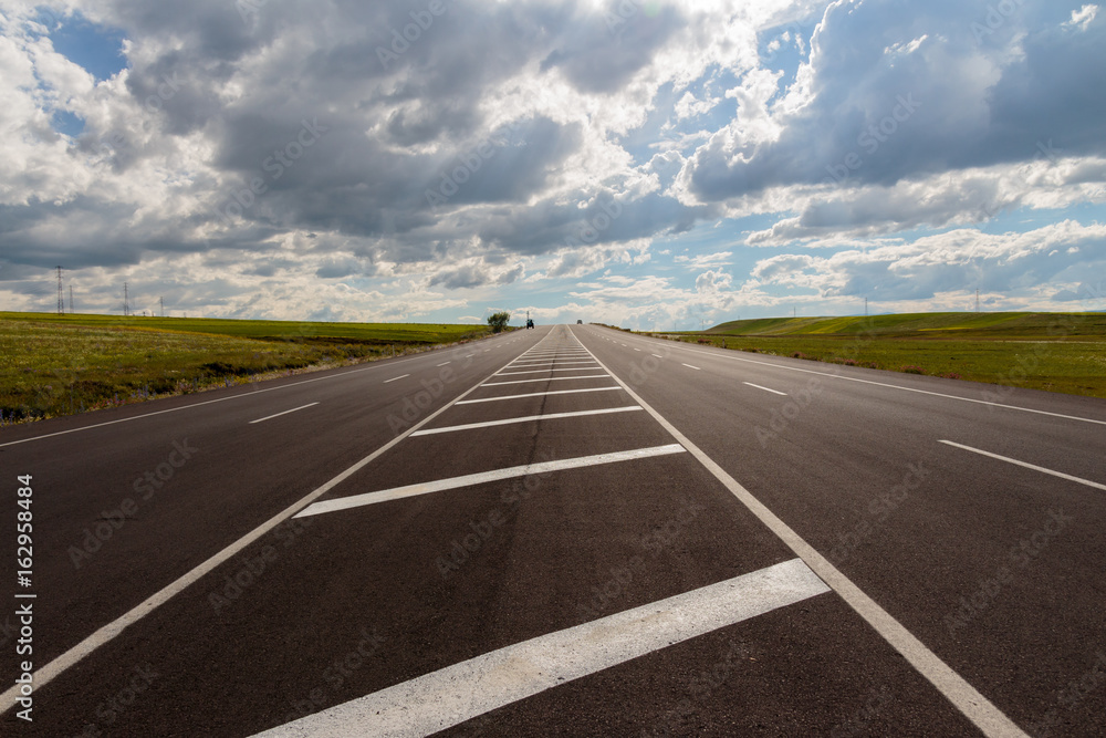 Fototapeta premium Highway. Open views and sunny weather to travel.