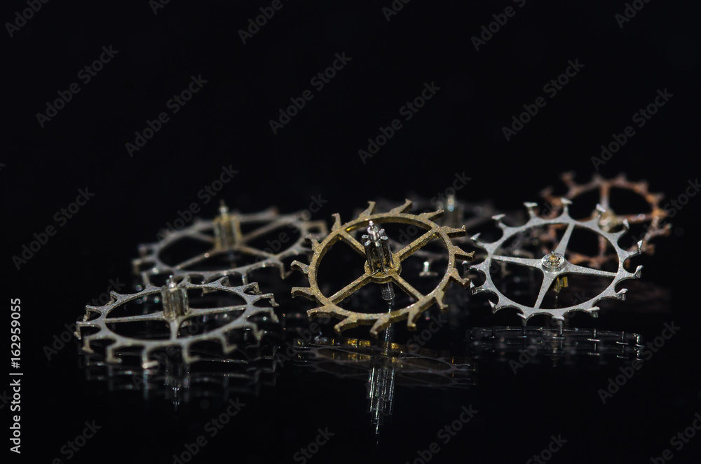 Watch Parts: Variety of Escape Wheels on Black Background