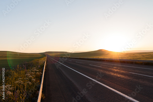 Highway. Open views and sunny weather to travel.