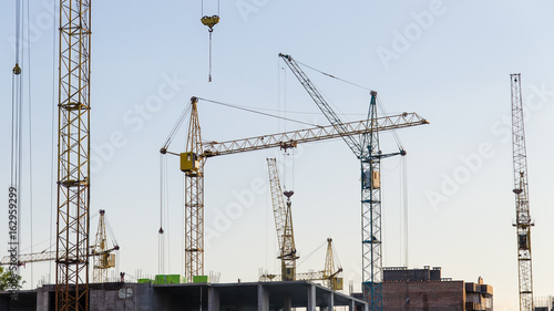 Cranes on the sky background
