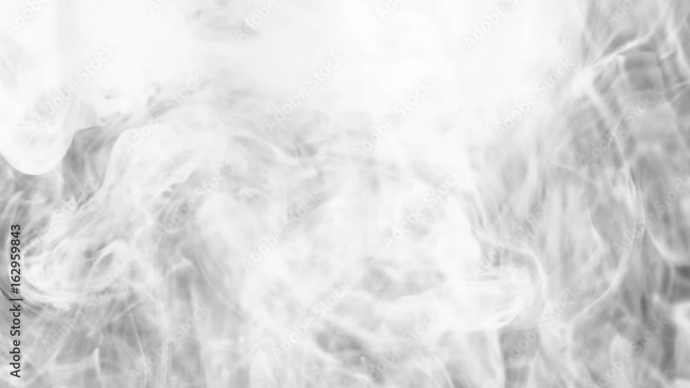 The smoke is spinning against a black background. Slow motion The smoke is spinning against a black background. Slow motion