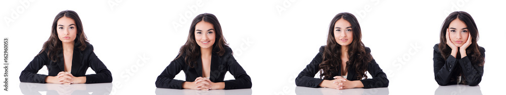 Young businesswoman sitting at desk on white Young businesswoman sitting at desk on white