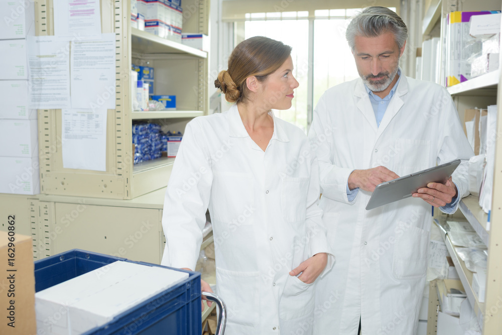 Fototapeta premium pharmacists discussing patients prescription