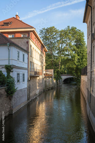 Old buildings, bridge and water canal on the Kampa Island in Prague, Czech Republic.