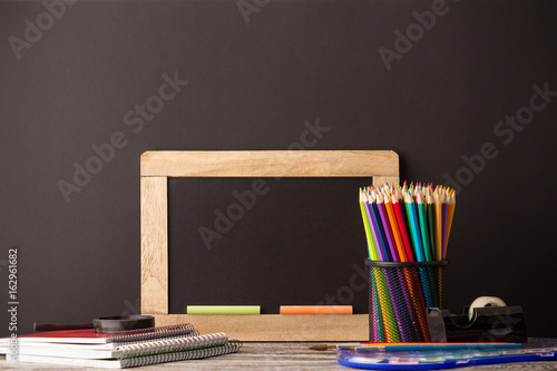 back to school, school supplies on wooden background